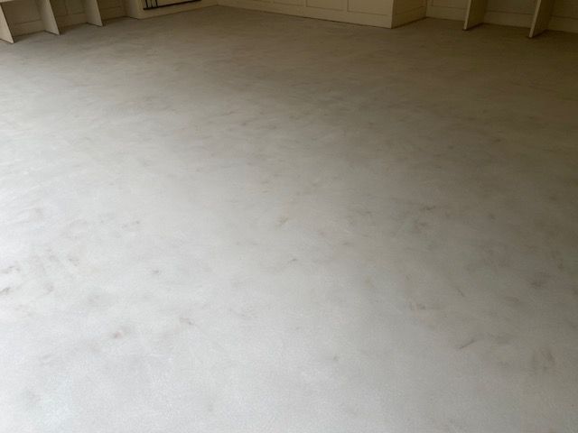 sanded floor being prepped for laminate flooring